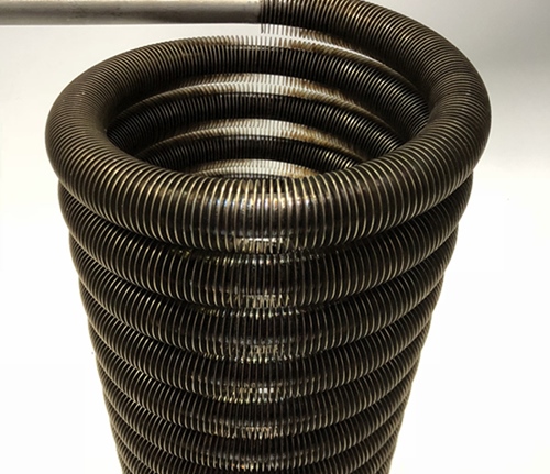 Laser welded finned tube coil showing precise fin attachment and uniform spacing