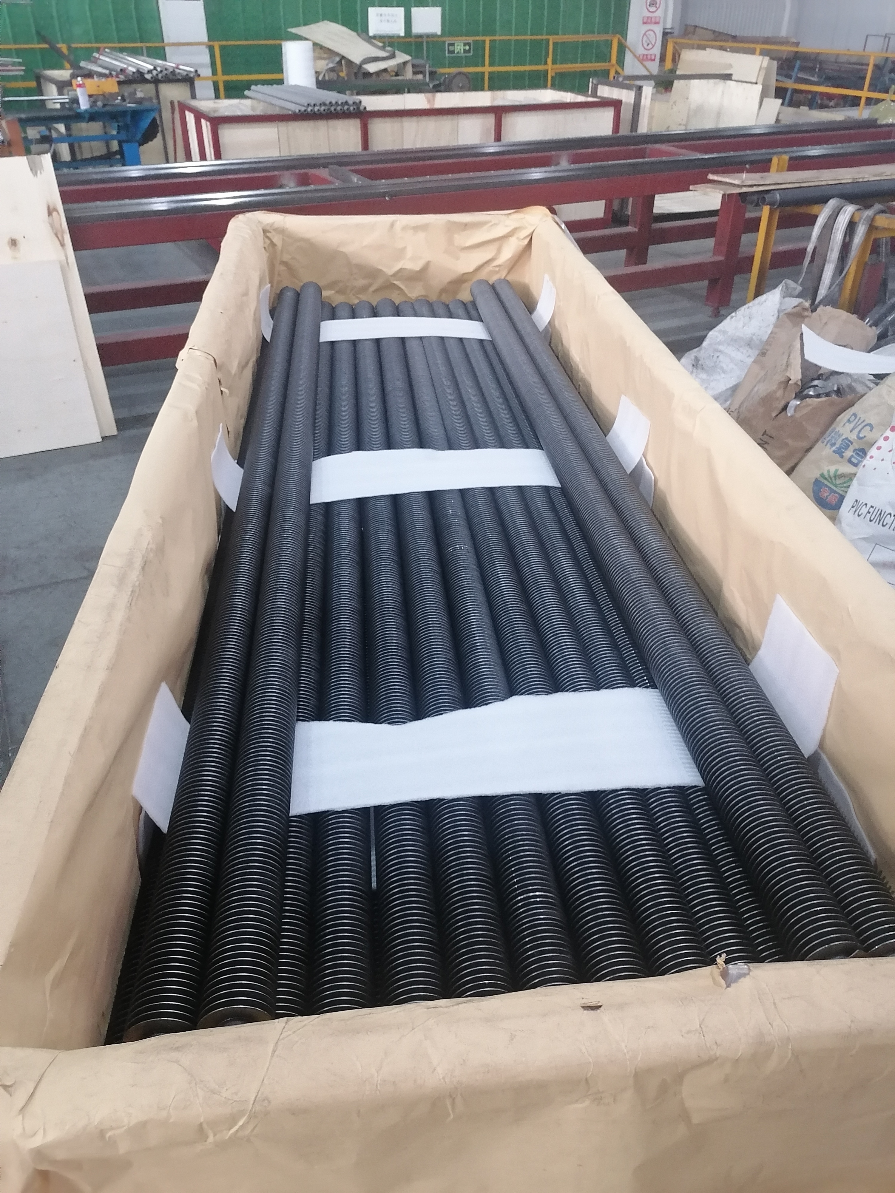 Laser welded carbon steel finned tubes showing precise weld seams and uniform fin attachment